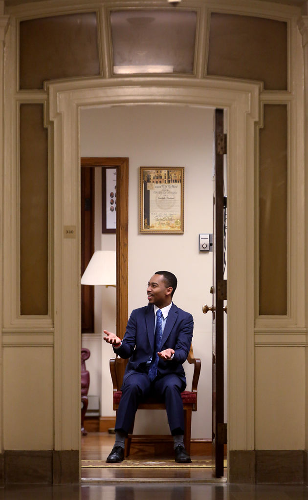 Jay Nelson laughs inside Sen. Jamilah Nasheed's office